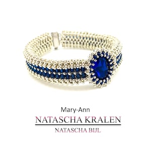 May include: A beaded bracelet with a silver-colored band and a dark blue central design. The bracelet features a large, oval-shaped, dark blue gemstone. The text "Mary-Ann NATASCHA KRALEN NATASCHA BIJL" is below the bracelet.