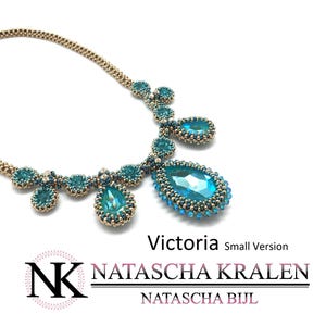 May include: A turquoise and gold beaded necklace with a large teardrop-shaped crystal pendant. The necklace is called "Victoria" and is a small version. The designer is Natascha Bijl.