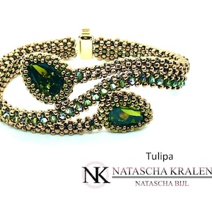 May include: A gold-toned beaded bracelet with two olive-green teardrop-shaped gemstones. The bracelet has a gold clasp and is set against a white background. The word "Tulipa" is visible.
