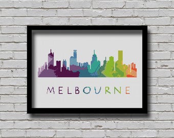 May include: A colorful pixelated skyline of Melbourne, Australia. The skyline is made up of different shades of purple, blue, green, yellow, and orange. The word "MELBOURNE" is written in white letters below the skyline.