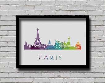 May include: A colorful pixelated skyline of Paris, France, with the Eiffel Tower as the focal point. The skyline is rendered in a rainbow gradient, with the Eiffel Tower in shades of purple and blue. The word "PARIS" is written in white below the skyline.