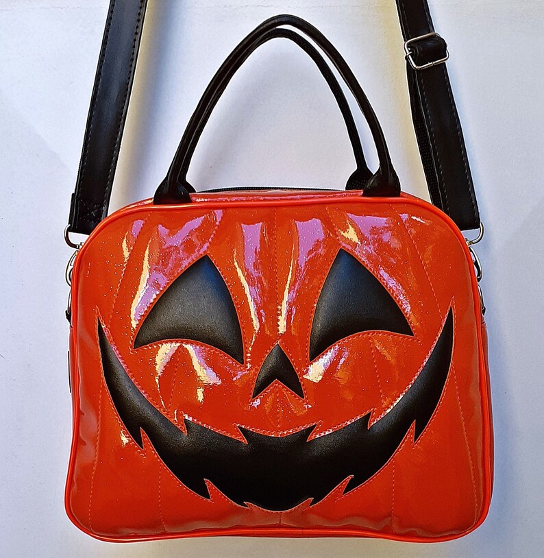 Nara Prado Pumpkin Glitter Suitcase
