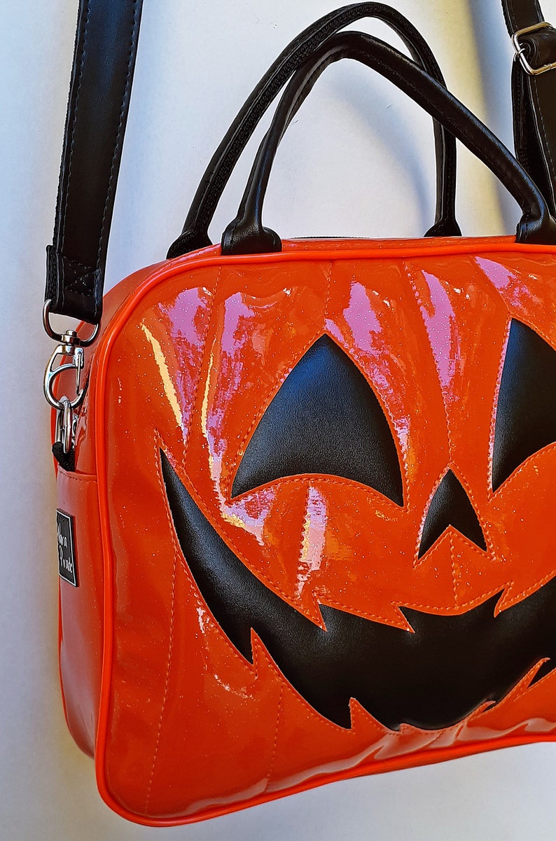 Nara Prado Pumpkin Glitter Suitcase