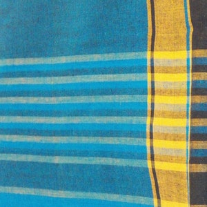 May include: A blue and white striped fabric with a yellow and black border. The fabric has a woven texture.