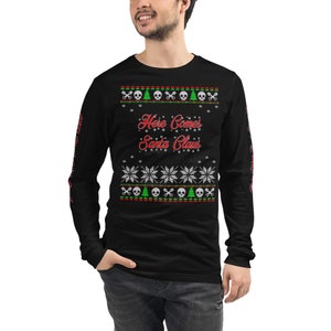 May include: Black long-sleeve shirt with a Christmas-themed design featuring skulls, Christmas trees, snowflakes, and the text "Here Comes Santa Claus".