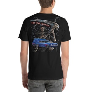 May include: Black t-shirt with a graphic of a skeleton holding a scythe and a blue car. The text "The Soul Collector" is printed on the shirt.