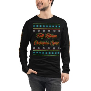May include: Black long-sleeve shirt with a Christmas-themed design featuring a red and orange graphic that says "Full Blown Christmas Spirit" surrounded by green and blue snowflakes.