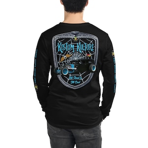 May include: Black long-sleeve shirt with a graphic of a vintage hot rod car in front of a spider web. The text "Kustom Kulture" is above the car and "Old School is Still Cool" is below the car.