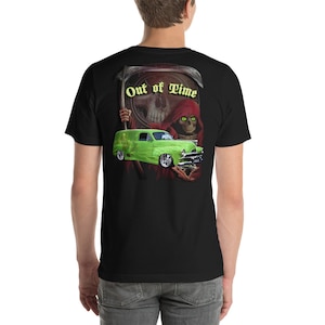 May include: A black t-shirt with a green car and a grim reaper graphic. The text "Out of Time" is printed on the shirt.