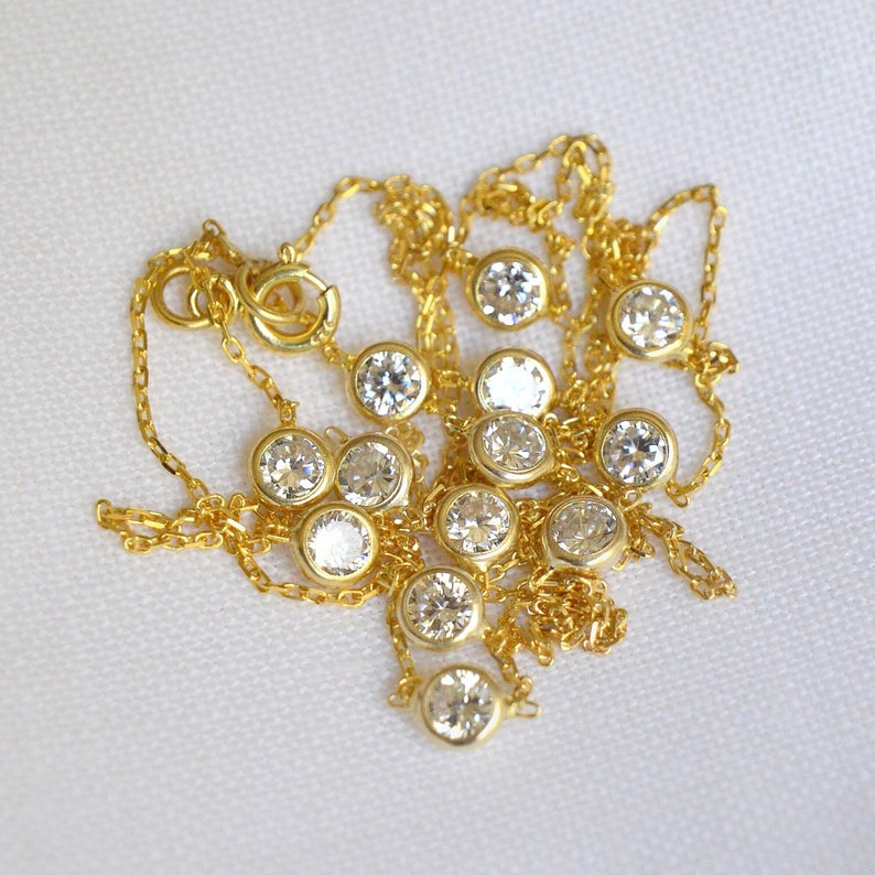 Close-up of a gold plated chain with clustered CZ stones, showcasing the clarity, brilliant sparkle, and precise cuts of the diamonds.