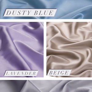 May include: Four fabric swatches in different colors: dusty blue, lavender, beige, and light grey. The fabric is smooth and silky.