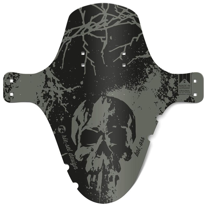 May include: A black and gray bicycle fender with a skull graphic. The fender has a splatter and branch design. The text "riesel design" and "kol.ass" are visible. The fender is labeled "Made in Germany Original Racing Design."