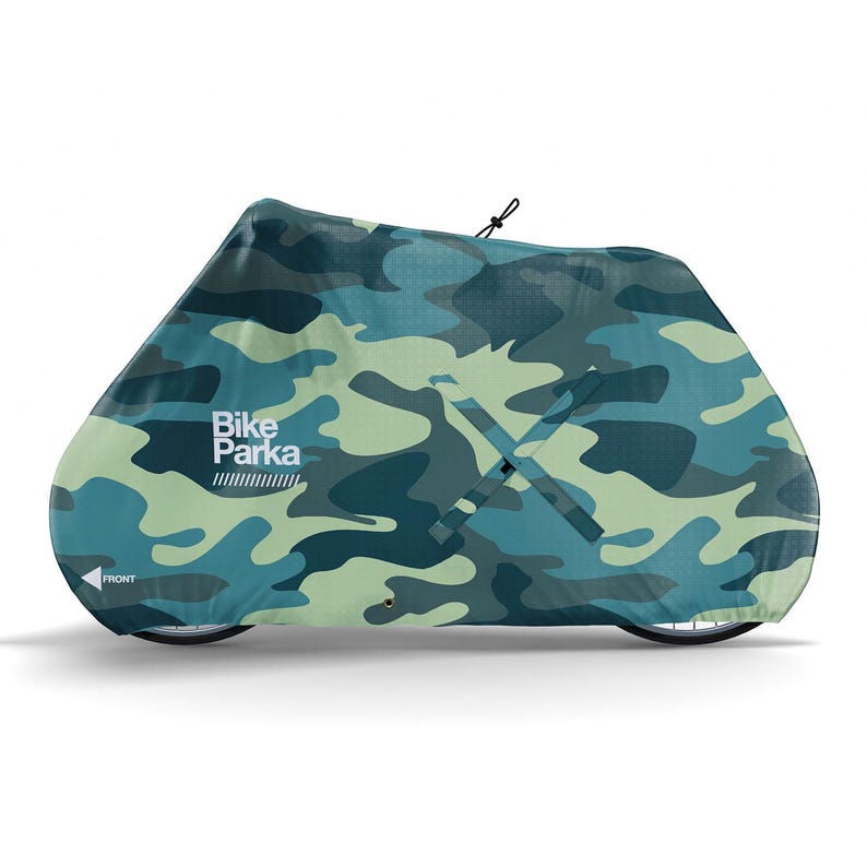 May include: A camouflage bike cover in shades of blue and green. The cover is shaped to fit a bicycle and features the text "Bike Parka" in white. The word "FRONT" is also visible on the cover.