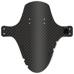 May include: A black carbon fiber bicycle fender with a textured weave pattern. The fender has a unique shape with mounting holes and the text "kol ass" and "riesel design". The product is labeled "Made in Germany Original".