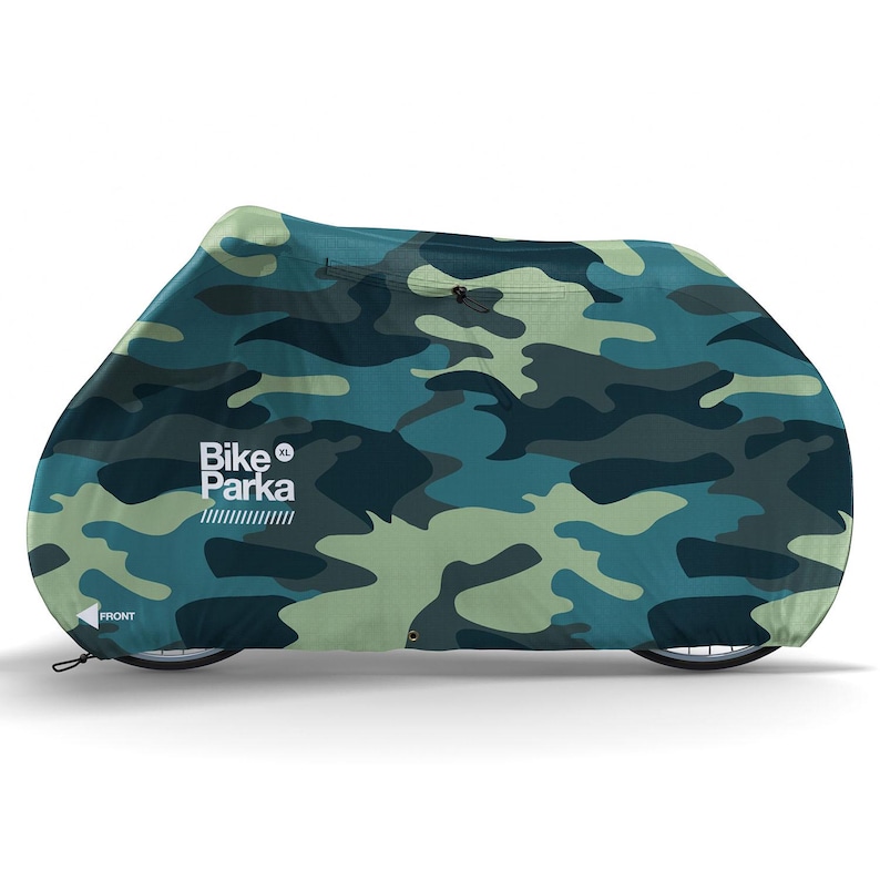 May include: A camouflage-patterned Bike Parka XL bicycle cover in shades of green and blue. The cover is designed to fully enclose a bicycle, protecting it from the elements. The word "FRONT" is printed on the lower left corner.