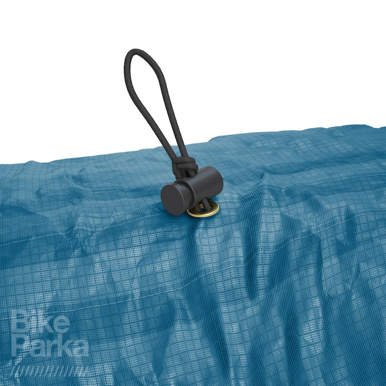 May include: Close-up of a blue tarp with a black cord and stopper. The tarp has a grid pattern and the text "Bike Parka" in white. The cord is attached to the tarp with a gold-colored grommet.
