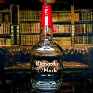 May include: A clear glass bottle with a red wax seal and a white label that reads "Richard's Mark Whiskey".
