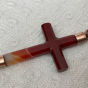 May include: A set of three ceramic mugs with a speckled, matte finish in cream, light grey, and dark grey. Each mug has a simple, minimalist design and a rounded handle.