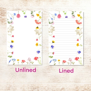 May include: Two printable stationery sheets with a floral border. The sheet on the left is unlined, while the sheet on the right is lined.