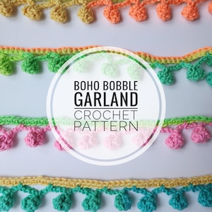 May include: A crochet garland pattern with the title "BOHO BOBBLE GARLAND CROCHET PATTERN". The garland is made with colorful yarn and features a series of bobbles in different colors, including yellow, green, pink, and blue.