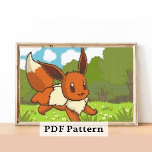 May include: A framed cross-stitch pattern featuring a cartoon Eevee character running through a grassy field. The artwork is in a wooden frame and includes the text "PDF Pattern" at the bottom.