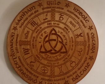 May include: A wooden circle with a Celtic knot design in the center. The circle is divided into eight sections, each with a different symbol and name. The symbols represent the eight sabbats of the Wheel of the Year, a pagan holiday cycle. The names of the sabbats are written in a stylized font. The text on the circle reads: "Samhain, Halloween,  Noti Eve, Yule, Winter Solstice, Imbolc, Candlemas,  Weald, Ostara, Spring Equinox, Beltane, May Eve, Walpurgis, Litha, Summer Solstice, Luchnassa, Lammas,  Noti Eve, Mabon, Autumn Equinox."