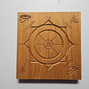 May include: Wooden board with a carved circle and a triangle with an eye inside. The circle has eight spokes and the words "Yes", "Maybe", "No", "Unknown", "Yes", "Maybe", "No", and "Unknown" are written around the circle.