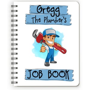 May include: Spiral-bound notebook with the text "Gregg The Plumber's JOB BOOK." The cover features a cartoon plumber in blue overalls and a cap, holding a red wrench and giving a thumbs-up.