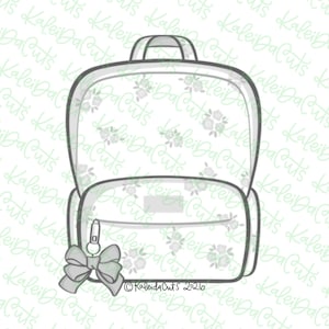 May include: A white backpack cookie cutter with a floral pattern outline, featuring a front pocket, a top handle, and a decorative bow charm attached to the zipper. The base of the cutter includes the text KaleiDaCuts 2026 in a clear font.