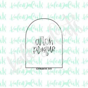 May include: A black and white cookie cutter in the shape of a tombstone with the text "ouch plague" on it.