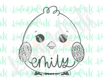 May include: A black and white line drawing of a cartoon chick with large eyes and a small beak. The chick is wearing a headband with the name "Emily" written on it.