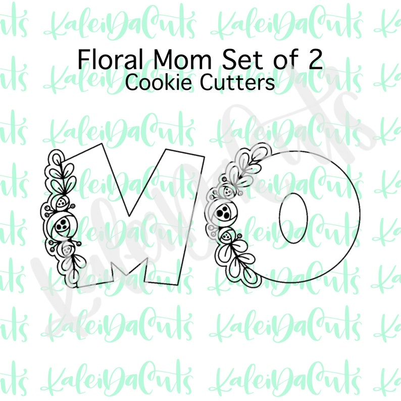 May include: A set of two cookie cutters, one shaped like the letter M and the other shaped like the letter O. Both letters are decorated with floral designs.