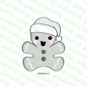 May include: A gray gingerbread man cookie wearing a white Santa hat with a red pom-pom. The cookie has a happy face with black eyes, a red mouth, and two black buttons. The cookie has a white icing design around the edges.