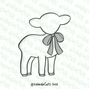 May include: A white lamb outline with a gray bow, a design for crafts. The image includes the text "@KaleidaCuts 2025" in the bottom corner. The lamb has a simple, cartoon-like appearance.