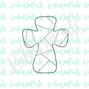 May include: A gray cross cookie cutter with a geometric pattern. The cutter is designed for making cookies in the shape of a cross.