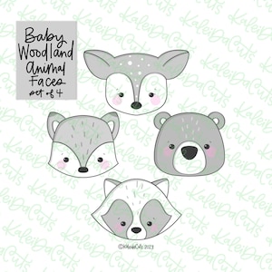 May include: Four baby woodland animal face designs: a deer, fox, bear, and raccoon. Each face is gray with pink cheeks and black outlines. The text "Baby Woodland Animal Faces set of 4" is in the upper left corner.