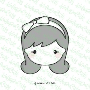 May include: A black and white line drawing of a girl's face with a bow in her hair. The girl has large eyes and a small mouth. The drawing is on a white background.