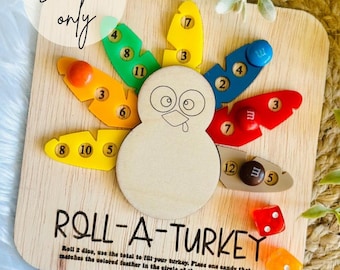 May include: A wooden game board shaped like a turkey with colorful feathers. The game is called "Roll-A-Turkey" and the instructions are to roll two dice, use the total to fill your turkey, place one candy that matches the colored feather in the circle of the number you rolled.