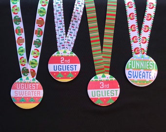 May include: Four colorful medals with ribbons. The medals have text that reads "Ugliest Sweater", "2nd Ugliest", "3rd Ugliest", and "Funniest Sweater". The ribbons have festive patterns, including Christmas lights and sweaters.