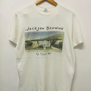 Vintage 80er Jahre Jackson Browne: US Tour 1986 T-Shirt / Rock Musik / Lives in the Balance / Band / Rock T-Shirt / Rock n Roll / weiß / M