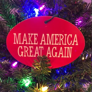 May include: Red oval Christmas ornament with the text "MAKE AMERICA GREAT AGAIN" in white letters.