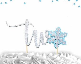 Two Snowflake silver glitter baby blue cake topper for second birthday winter wonderland theme
