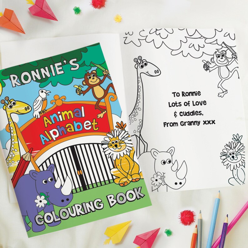 May include: A personalized coloring book with a colorful cover featuring a rhino, giraffe, lion, and monkey. The title of the book is "Ronnie's Animal Alphabet Coloring Book".