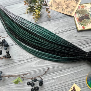 Set of thin synthetic dreads black and ombre green dreads with silver gray ends with braids and twists dark emerad dreadlocks