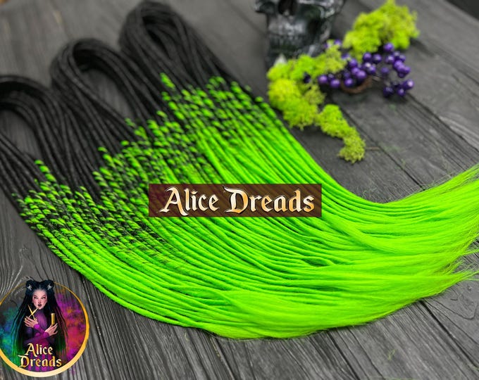 Set of thin synthetic dreads in black to bright green hair extensions