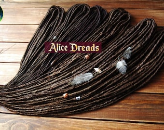 Brown thin dreads with feather beads. Classic dreadlocks