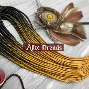 Dreadlock extensions set of thin synthetic dreads Amber Tree ombre black to golden blonde yellow blond dreadlocks