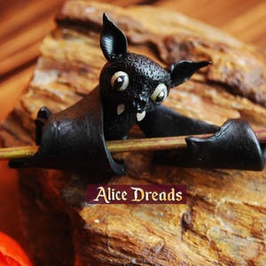 Handmade beads for dreadlocks, made from durable polymer clay Available in 5 mm, 6 mm, and 8 mm sizes. Perfect for adding bohemian flair and Halloween style to your dreadlocks. Easy to use and lightweight for comfortable wear.