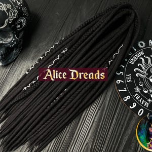 Black wool dreads with braids. Double ended or single ended dreadlocks. With white stripes wrapped accents