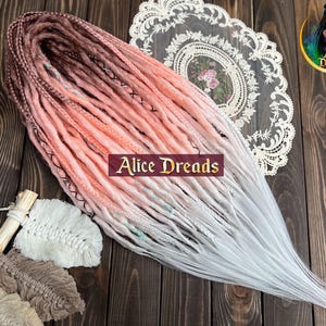 Full set of crochet synthetic dreads brown to peach to white with braids and criss cross accents pastel colors